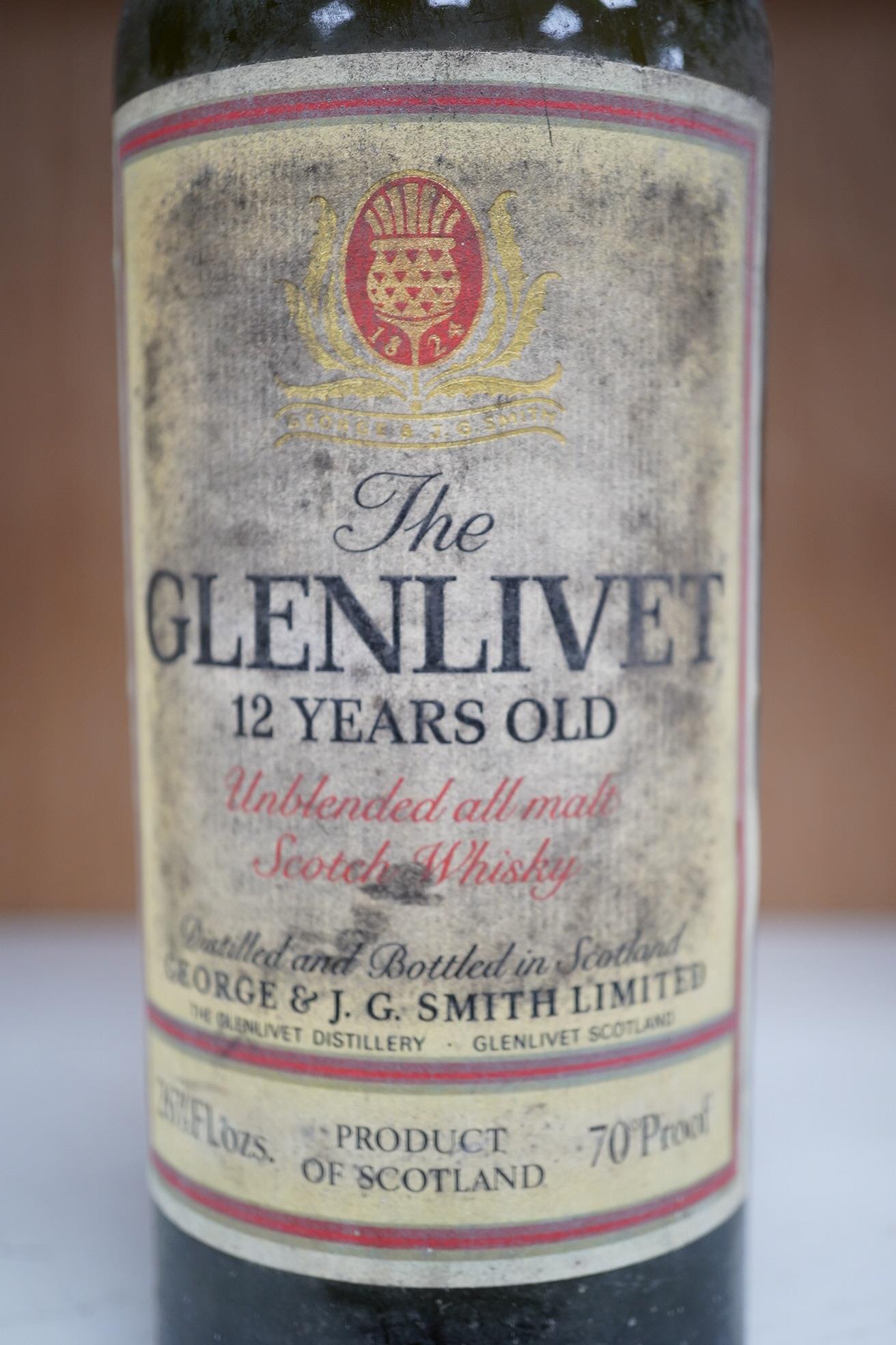 A vintage bottle of The Glenlivet 12 year old single malt whisky, 26 2/3 Fl oz. Condition - fair to good, storage unknown